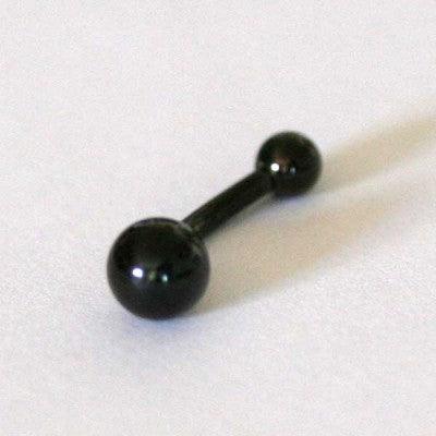 piercing de umbigo da tal da realeza em um fundo branco aveludado. a peça é preta, curvada e possui esferas nas extremidades.